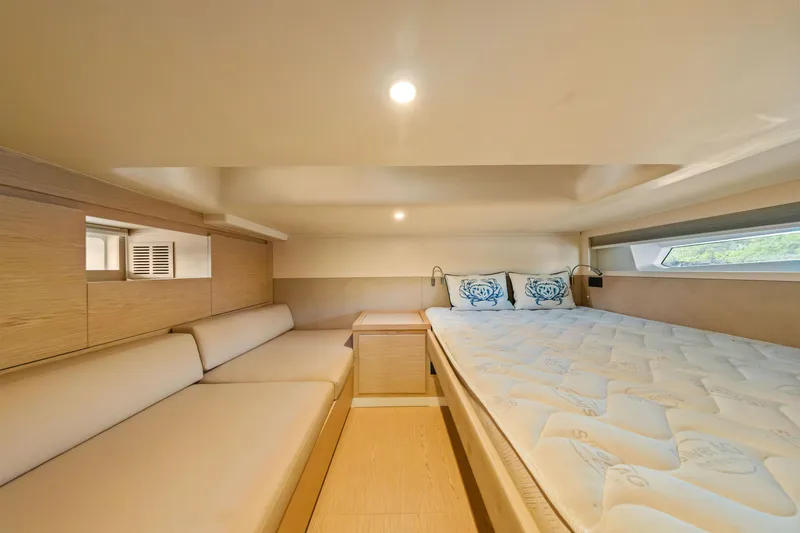 Slide: The Image of Luxurious interior cabin of 2024 Solaris Power 44 yacht, featuring cozy bedding and elegant design. - 29