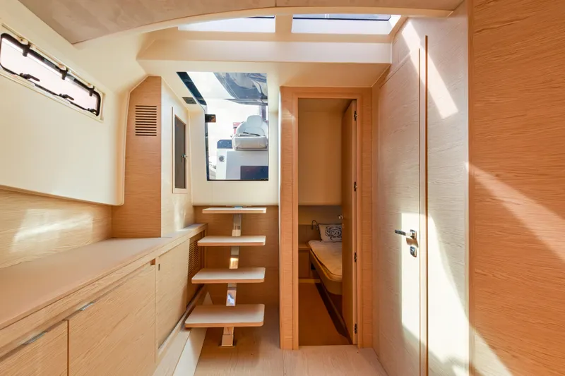 Slide: The Image of Interior of 2024 Solaris Power 44 yacht, featuring modern wood finishes and natural lighting. - 30