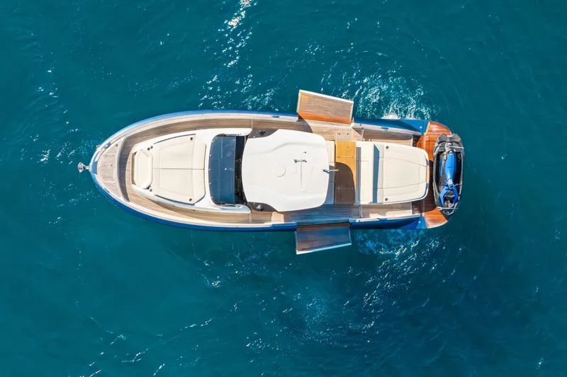 Slide: The Image of Top view of 2024 Solaris Power 44 yacht on clear blue water. - 5