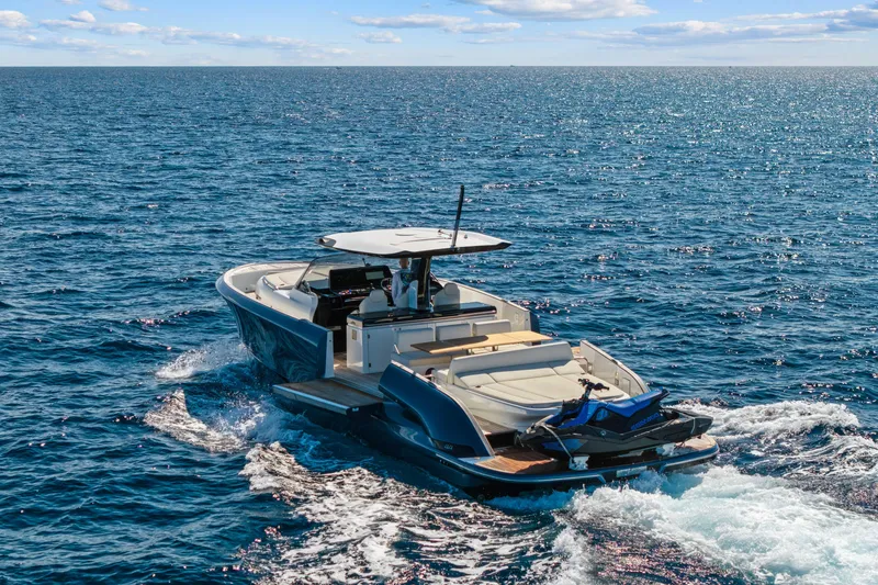 Slide: The Image of 2024 Solaris Power 44 yacht cruising on open sea under clear blue sky. - 6