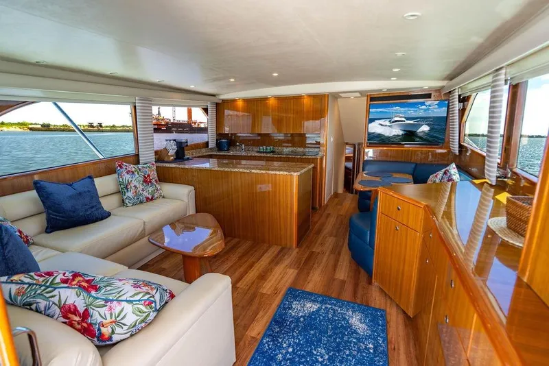 Slide: The Image of Luxurious interior of 2006 Viking 56 Convertible yacht with elegant wood finishes and scenic views. - 15