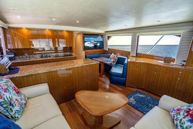 Slide: The Image of Luxurious interior of 2006 Viking 56 Convertible yacht with elegant wood finishes and ocean view. - 16
