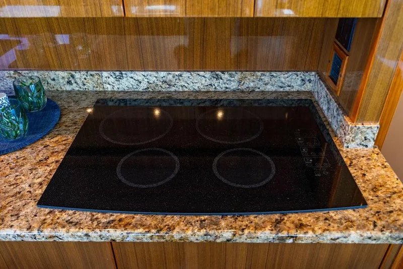 Slide: The Image of Granite countertop with electric cooktop in 2006 Viking 56 Convertible yacht kitchen. - 22