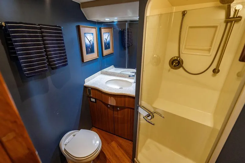 Slide: The Image of Bathroom interior of 2006 Viking 56 Convertible yacht with shower and vanity. - 28