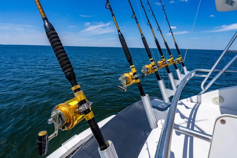Slide: The Image of Fishing rods on a 2006 Viking 56 Convertible boat, ocean view. - 36