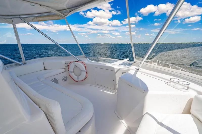 Slide: The Image of 2006 Viking 56 Convertible yacht interior with ocean view and clear blue sky. - 37