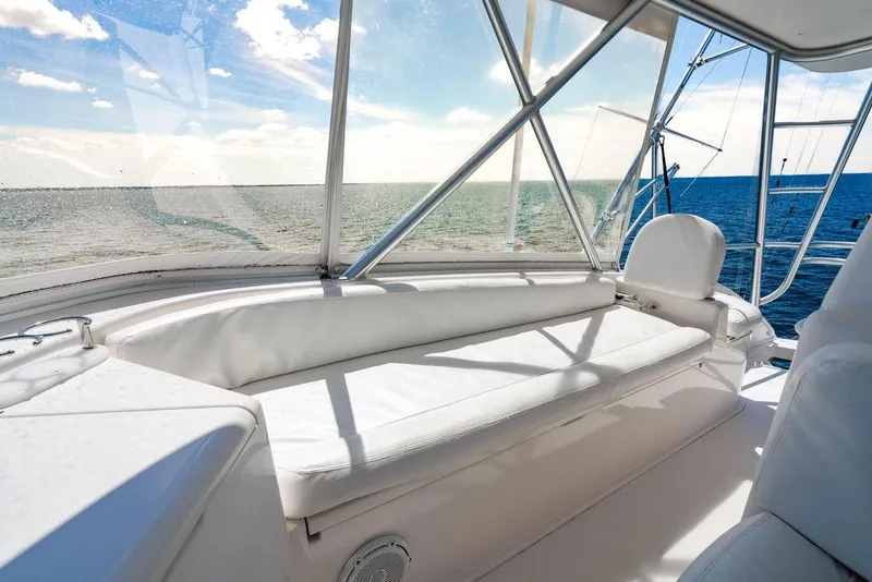 Slide: The Image of 2006 Viking 56 Convertible yacht interior with ocean view and white seating. - 38
