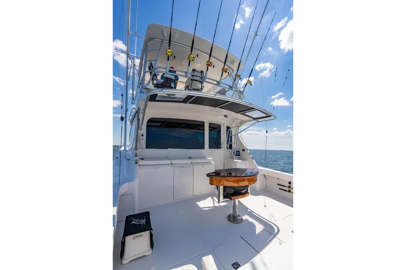 Slide: The Image of 2006 Viking 56 Convertible yacht deck with fishing rods and ocean view. - 45