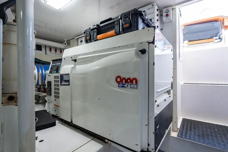 Slide: The Image of Engine room of 2006 Viking 56 Convertible with Onan generator. - 54