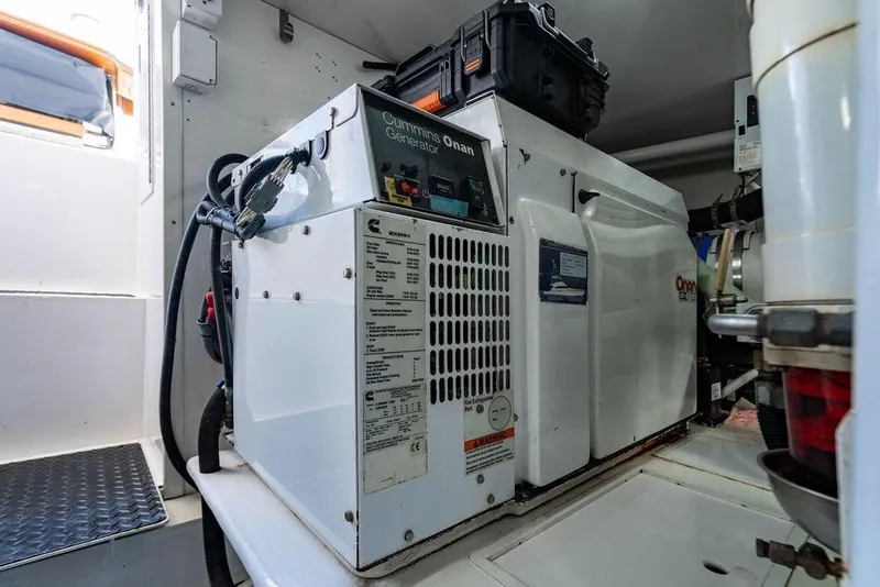 Slide: The Image of Cummins Onan generator inside a 2006 Viking 56 Convertible yacht engine room. - 55
