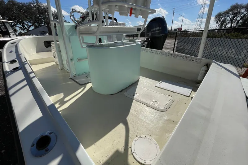 Slide: The Image of 1973 Mako 1901 Inshore boat interior with steering console and Yamaha engine. - 4