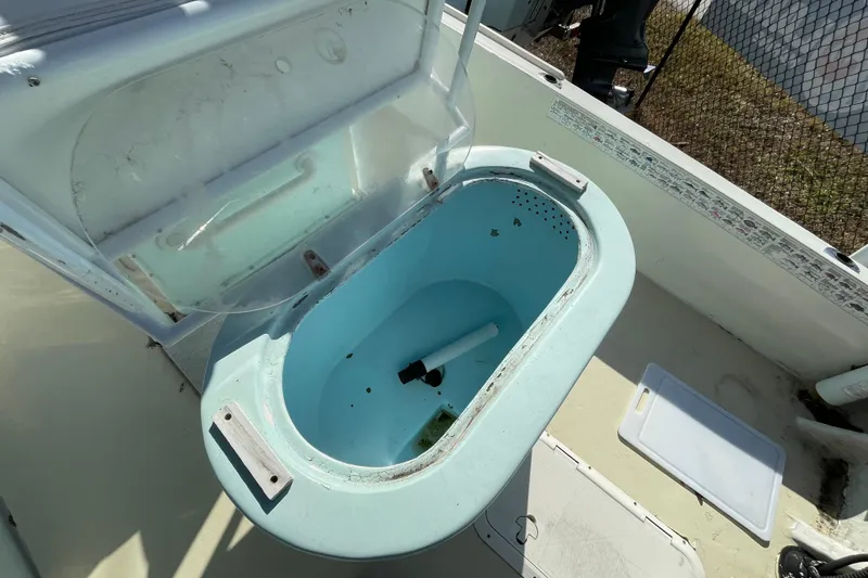 Slide: The Image of 1973 Mako 1901 Inshore boat with open livewell, showing interior details. - 5