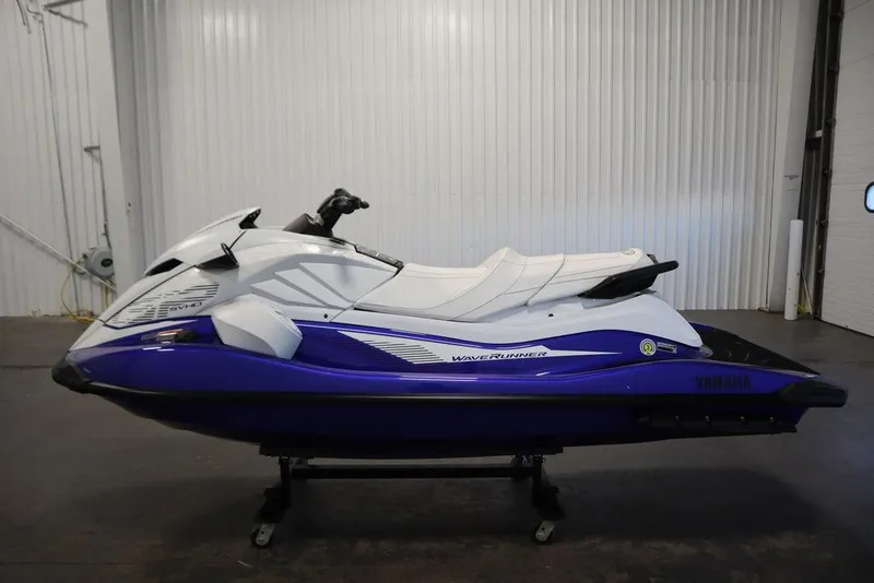 Slide: The Image of 2024 Yamaha WaveRunner GP SVHO in a showroom, featuring sleek white and blue design. - 10