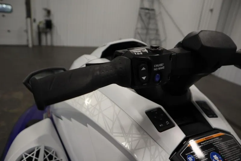 Slide: The Image of 2024 Yamaha WaveRunner GP SVHO handlebar controls in a showroom setting. - 15