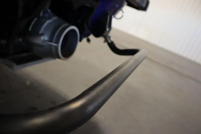 Slide: The Image of Close-up of 2024 Yamaha WaveRunner GP SVHO exhaust and handlebar in a garage. - 24