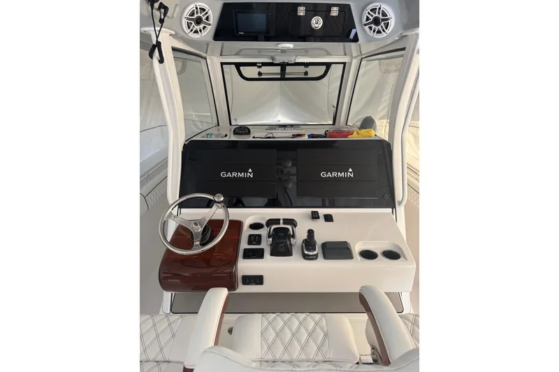 Slide: The Image of 2021 Sportsman Open 352 Center Console helm with Garmin navigation system. - 11