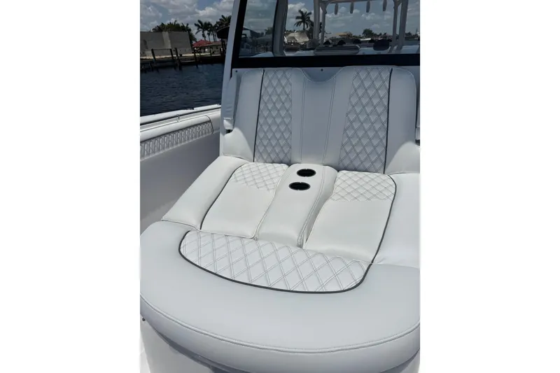 Slide: The Image of Luxurious seating on 2021 Sportsman Open 352 Center Console boat with cup holders. - 16