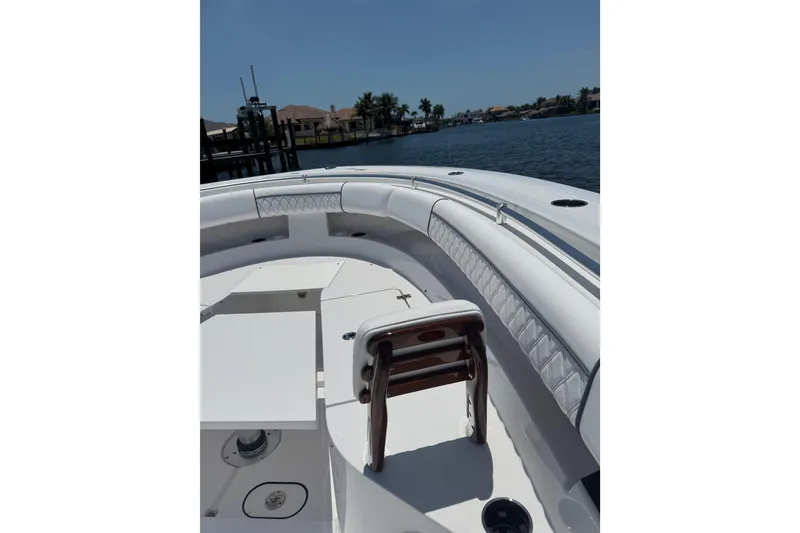 Slide: The Image of 2021 Sportsman Open 352 Center Console boat interior with seating and water view. - 18