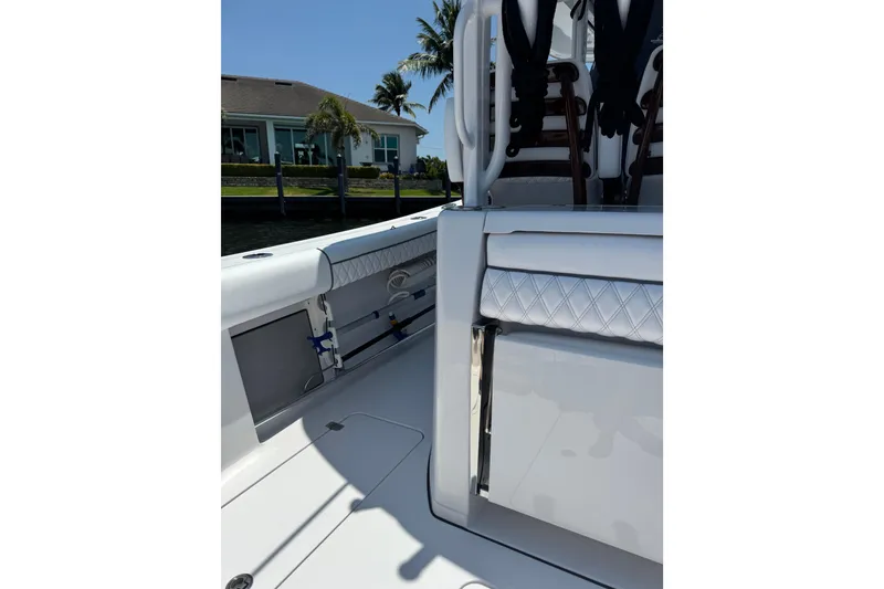 Slide: The Image of 2021 Sportsman Open 352 Center Console boat interior with seating and storage. - 22