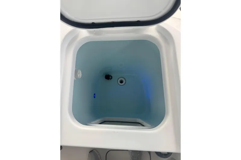 Slide: The Image of 2021 Sportsman Open 352 Center Console boat cruising near waterfront homes. - 29