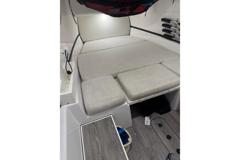 Slide: The Image of 2021 Sportsman Open 352 Center Console interior with cushioned seating and fishing rod holders. - 3