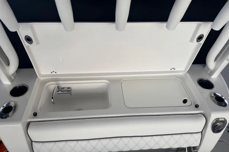 Slide: The Image of 2021 Sportsman Open 352 Center Console interior with diamond-stitched seating and cup holders. - 36