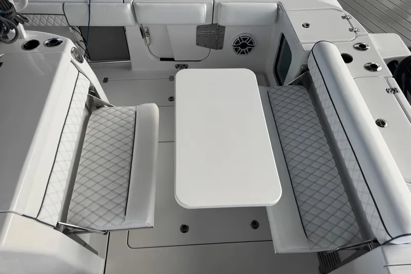 Slide: The Image of 2021 Sportsman Open 352 Center Console sink and storage area with rod holders. - 37