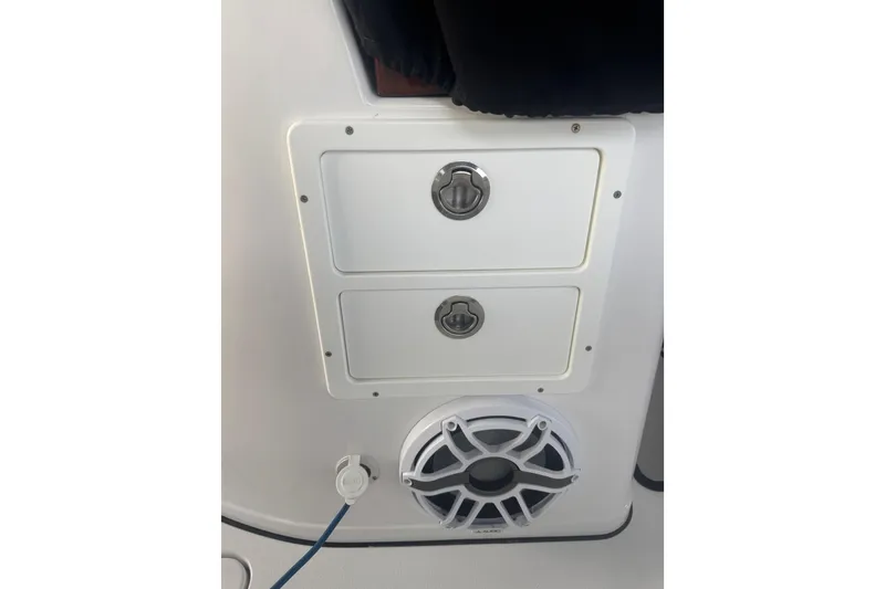 Slide: The Image of 2021 Sportsman Open 352 Center Console storage compartments and speaker detail. - 46