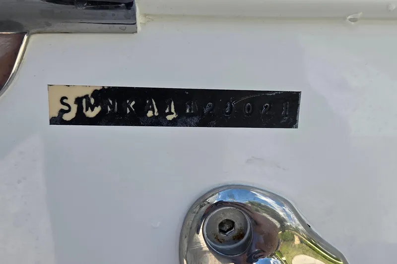 Slide: The Image of 2021 Sportsman Open 352 Center Console hull identification number on white surface. - 55