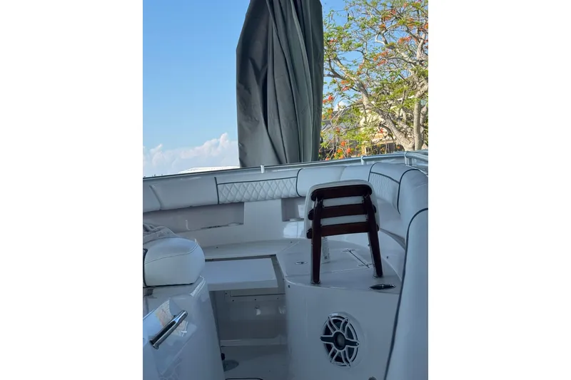 Slide: The Image of 2021 Sportsman Open 352 Center Console boat interior with seating and speaker. - 8