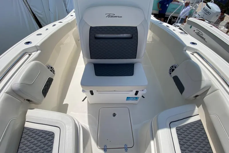 Slide: The Image of 2026 Pioneer 250 Pelagic boat interior with cushioned seating and modern design. - 8