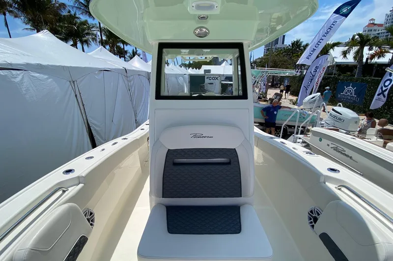 Slide: The Image of 2026 Pioneer 250 Pelagic boat interior at outdoor yacht show. - 9