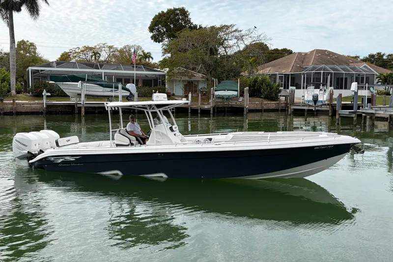 The Image of 2020 Glasstream 360 SCX boat on calm water near residential docks. - 0