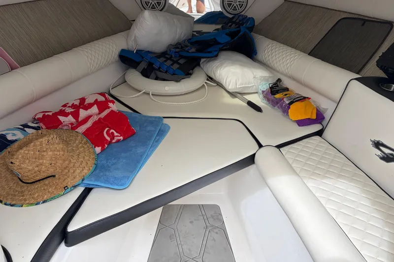 Slide: The Image of Interior of 2020 Glasstream 360 SCX boat with towels, hat, and life jackets. - 17
