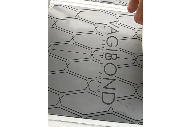 Slide: The Image of "Vagabond" text on Glasstream 360 SCX 2020 boat with geometric pattern background. - 18