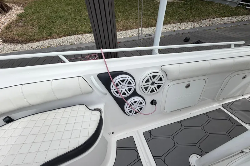 Slide: The Image of 2020 Glasstream 360 SCX boat interior with white seating and speaker system. - 6
