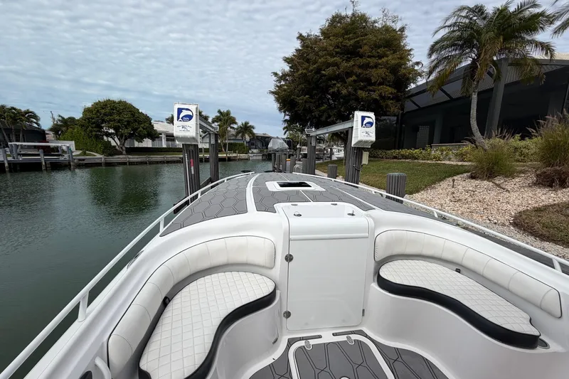 Slide: The Image of 2020 Glasstream 360 SCX boat docked, featuring sleek seating and modern design. - 9