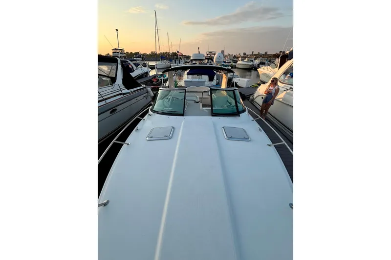 Slide: The Image of 2008 Formula 350 Sun Sport docked at sunset with nearby boats. - 2