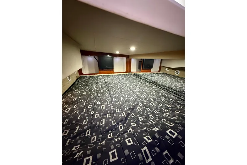 Slide: The Image of Interior cabin of 2008 Formula 350 Sun Sport with patterned bedding and ambient lighting. - 20