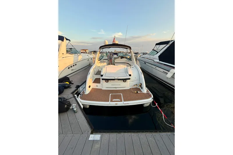 Slide: The Image of 2008 Formula 350 Sun Sport boat docked at marina, rear view. - 6