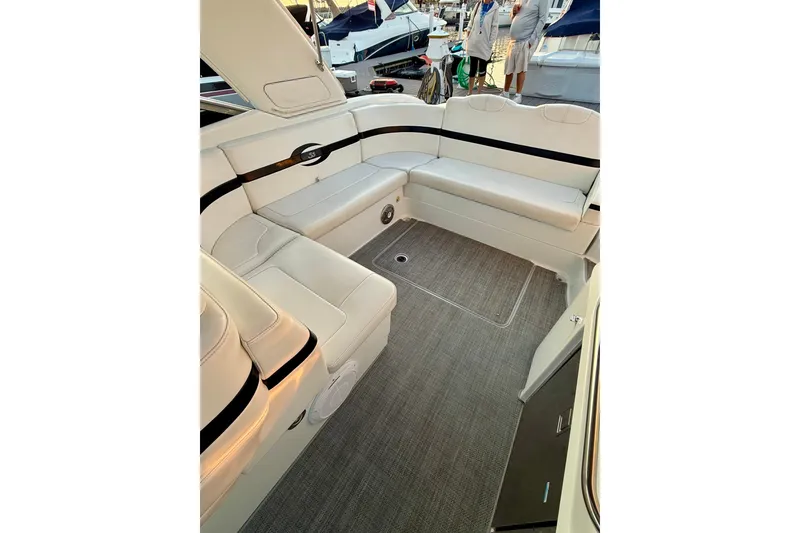 Slide: The Image of 2008 Formula 350 Sun Sport boat interior with white seating and gray flooring. - 8