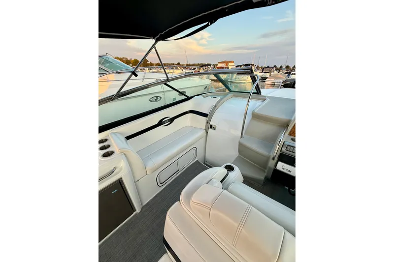 Slide: The Image of 2008 Formula 350 Sun Sport boat interior with white seating and dashboard view. - 9