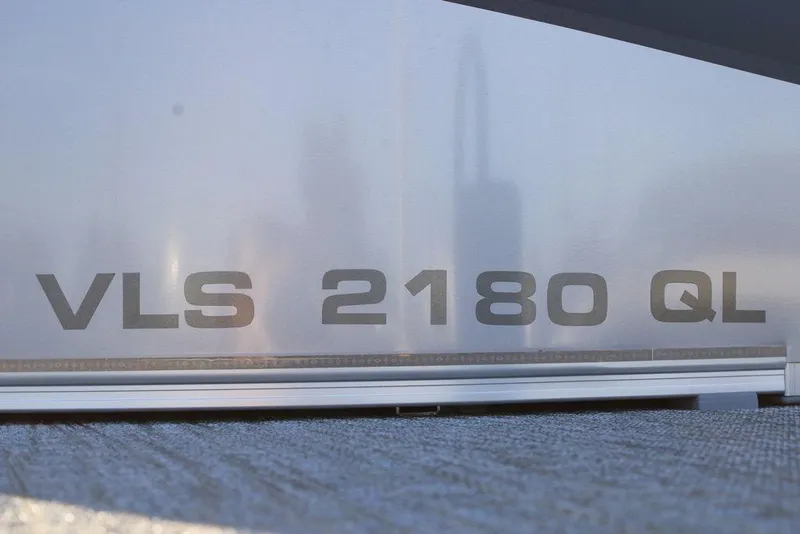 Slide: The Image of 2026 Avalon VLS QUAD LOUNGER 21 model detail with "VLS 2180 QL" text. - 12