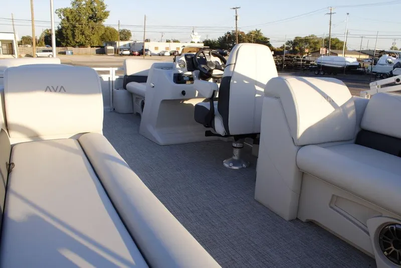 Slide: The Image of 2026 Avalon VLS QUAD LOUNGER 21 interior with plush seating and modern helm. - 32