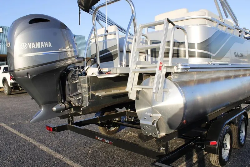Slide: The Image of 2026 Avalon VLS QUAD LOUNGER 21 pontoon boat with Yamaha engine on trailer. - 38