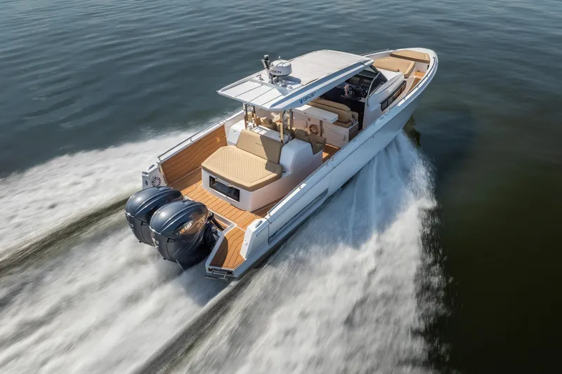 The Image of 2024 Opus OPUS 12 boat cruising on water with dual outboard engines. - 1