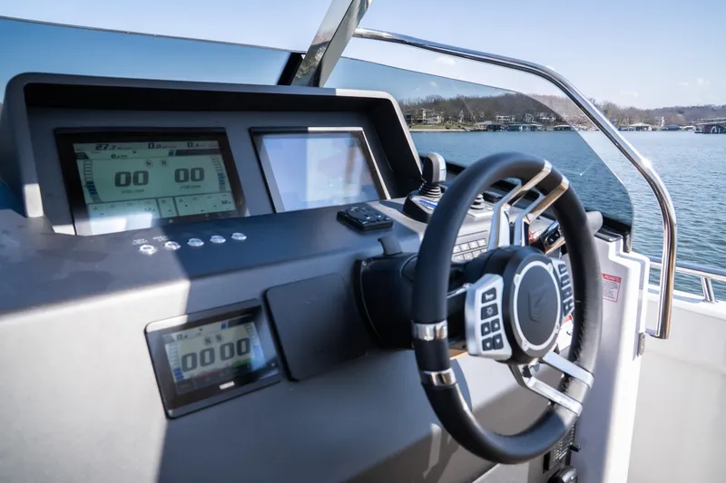 Slide: The Image of Cockpit of 2024 Opus OPUS 12 boat with modern steering and digital displays. - 11