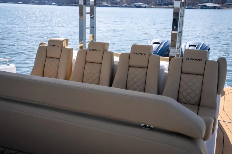 Slide: The Image of Luxurious seating on the 2024 Opus OPUS 12 boat, featuring elegant design and waterfront view. - 12