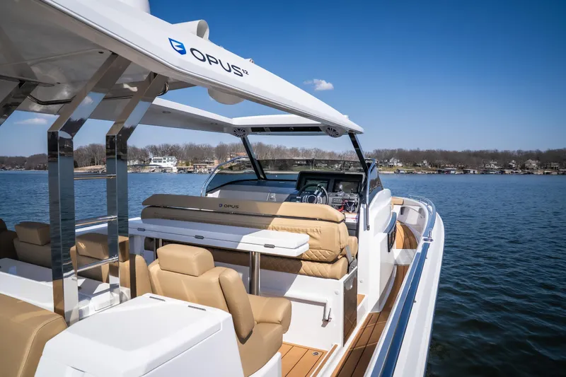 Slide: The Image of Luxurious 2024 Opus OPUS 12 yacht on a serene lake under clear blue skies. - 16