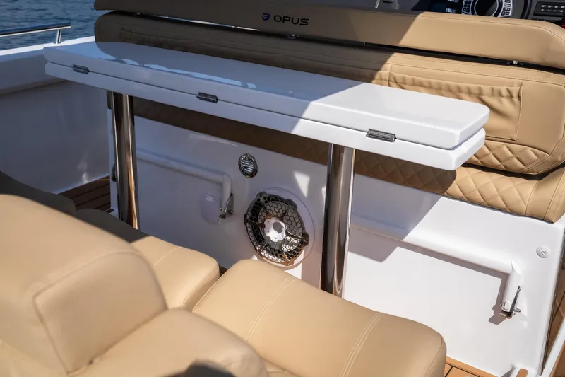 Slide: The Image of Luxurious interior of 2024 Opus OPUS 12 boat with beige seating and sleek table design. - 17